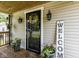 Inviting front porch with decorative flower pots and seasonal sunflower wreath at 730 N Forsythe St, Franklin, IN 46131