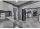 Modern kitchen featuring white cabinetry, stainless steel appliances, and stylish tile flooring at 730 N Forsythe St, Franklin, IN 46131