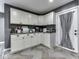 Well-organized kitchen featuring grey countertops and white cabinets at 730 N Forsythe St, Franklin, IN 46131