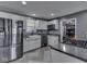 Bright kitchen showcasing white cabinets, stainless steel appliances, and a farmhouse sink at 730 N Forsythe St, Franklin, IN 46131