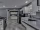 Well-lit kitchen offering stainless steel appliances, a farmhouse sink, and modern finishes at 730 N Forsythe St, Franklin, IN 46131