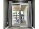 View of the deck through the sliding glass door, decorated with furniture and flowers at 730 N Forsythe St, Franklin, IN 46131