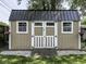 Exterior of a well-maintained backyard shed with painted wood siding, windows and carriage doors at 730 N Forsythe St, Franklin, IN 46131