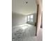 Unfinished bedroom features natural light and a blank canvas for personalization at 7305 Bayview Run # 13-605, McCordsville, IN 46055