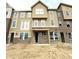 New construction townhome showing brick and siding facade and covered entry at 7305 Bayview Run # 13-605, McCordsville, IN 46055