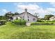 Backyard with green grass and garden at 7657 Winding Creek Dr, Indianapolis, IN 46236