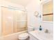 Bright bathroom featuring a glass door shower and a large mirror at 7657 Winding Creek Dr, Indianapolis, IN 46236