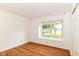 Bedroom features sleek flooring, a bright window and a neutral color palette at 7657 Winding Creek Dr, Indianapolis, IN 46236