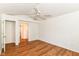 Neutrally decorated bedroom with an open closet and view into the hallway, showing the flow at 7657 Winding Creek Dr, Indianapolis, IN 46236