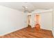 Spacious bedroom with neutral walls, ceiling fan and new floors, offering a blank canvas at 7657 Winding Creek Dr, Indianapolis, IN 46236