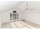Spacious bedroom featuring vaulted ceilings, large windows, and a ceiling fan at 7657 Winding Creek Dr, Indianapolis, IN 46236