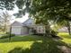 Charming home featuring a well-manicured lawn, brick accents, and an attached two-car garage at 7657 Winding Creek Dr, Indianapolis, IN 46236