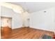 Spacious living room with hardwood floors, a vaulted ceiling, and a staircase at 7657 Winding Creek Dr, Indianapolis, IN 46236