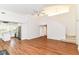 Open-concept living space featuring hardwood floors, stairs, and a view of the kitchen at 7657 Winding Creek Dr, Indianapolis, IN 46236