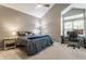 Spacious bedroom with a high ceiling, large window, and a dedicated workspace at 7803 Harbour, Indianapolis, IN 46240