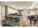 Modern kitchen with granite countertops, bar seating, and stainless steel appliances at 7803 Harbour, Indianapolis, IN 46240