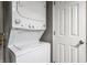 Efficient laundry area with a stacked washer and dryer and convenient access to storage at 7803 Harbour, Indianapolis, IN 46240