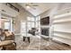 Bright living room with vaulted ceilings, fireplace, and large windows at 7803 Harbour, Indianapolis, IN 46240
