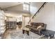 Cozy living room featuring a fireplace, bar seating, and natural light at 7803 Harbour, Indianapolis, IN 46240