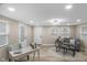 This living room features wood floors, a sofa, and a chess board at 7999 Englewood Rd, Indianapolis, IN 46240