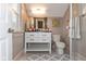Bright bathroom featuring a white vanity with modern fixtures and a glass-enclosed shower at 831 Weghorst St, Indianapolis, IN 46203