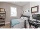 Cozy bedroom with double bed, desk and gray walls at 831 Weghorst St, Indianapolis, IN 46203