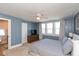 Bright bedroom features windows, bed, ceiling fan and side tables at 831 Weghorst St, Indianapolis, IN 46203