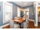 Dining room with hardwood floors, modern lighting, and neutral paint at 831 Weghorst St, Indianapolis, IN 46203