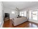Spacious living room featuring hardwood floors, large sectional sofa, and natural light at 831 Weghorst St, Indianapolis, IN 46203