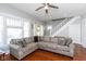 Well lit Living Room featuring Hardwood Floors and view of stairway and blue door at 831 Weghorst St, Indianapolis, IN 46203