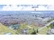 Scenic aerial view overlooking homes surrounded by trees with Geist Reservoir visible in the distance at 8510 N Carroll Rd, Indianapolis, IN 46236