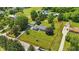 Aerial shot of a single Gathering home, large lot, and detached garage surrounded by mature trees at 8510 N Carroll Rd, Indianapolis, IN 46236