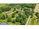 Idyllic aerial view of a home embraced by lush trees in a serene, landscaped setting at 8510 N Carroll Rd, Indianapolis, IN 46236