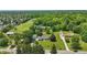 Drone shot of home with large yard and detached garage surrounded by mature trees at 8510 N Carroll Rd, Indianapolis, IN 46236