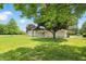 Spacious backyard with mature trees and well-manicured lawn at 8510 N Carroll Rd, Indianapolis, IN 46236