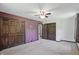Bedroom with tan carpet, neutral colored walls, and large closet at 8510 N Carroll Rd, Indianapolis, IN 46236