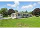 Well-maintained single-story home with a lush lawn and mature trees at 8510 N Carroll Rd, Indianapolis, IN 46236