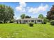 Attractive single-story home with a manicured lawn and tidy landscaping at 8510 N Carroll Rd, Indianapolis, IN 46236