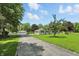 Charming single-story home with a long driveway, detached garage, and well-manicured lawn at 8510 N Carroll Rd, Indianapolis, IN 46236