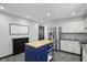 Open kitchen with stainless steel appliances, white cabinets, and center island at 8510 N Carroll Rd, Indianapolis, IN 46236