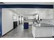 Open kitchen with white cabinets, stainless steel appliances, and center island at 8510 N Carroll Rd, Indianapolis, IN 46236