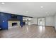 Open-concept living area featuring a stone fireplace and access to the kitchen at 8510 N Carroll Rd, Indianapolis, IN 46236