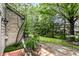 Private back patio with mature trees and landscaping, perfect for outdoor relaxation at 9263 Wadsworth Ct, Fishers, IN 46037