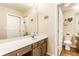 Bright bathroom featuring a large mirror, vanity with storage, and tiled flooring at 9263 Wadsworth Ct, Fishers, IN 46037