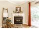 Close-up of the fireplace and mantle in the living room with decorative accents and neutral colors at 9263 Wadsworth Ct, Fishers, IN 46037