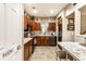 Well-equipped kitchen with wood cabinets, granite countertops, stainless steel appliances, and lots of light at 9263 Wadsworth Ct, Fishers, IN 46037