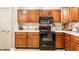 Updated kitchen featuring wood cabinets, modern appliances, granite countertops and pantry at 9263 Wadsworth Ct, Fishers, IN 46037