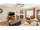 Inviting living room boasts a fireplace, hardwood floors, and relaxed seating arrangement at 9263 Wadsworth Ct, Fishers, IN 46037