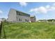 Backyard with a plush lawn, dark fence, and beautiful sky view at 9537 Crossfield Rd, Avon, IN 46123