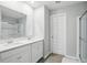 Modern bathroom with double sinks, quartz countertops, and a glass-enclosed shower at 9537 Crossfield Rd, Avon, IN 46123
